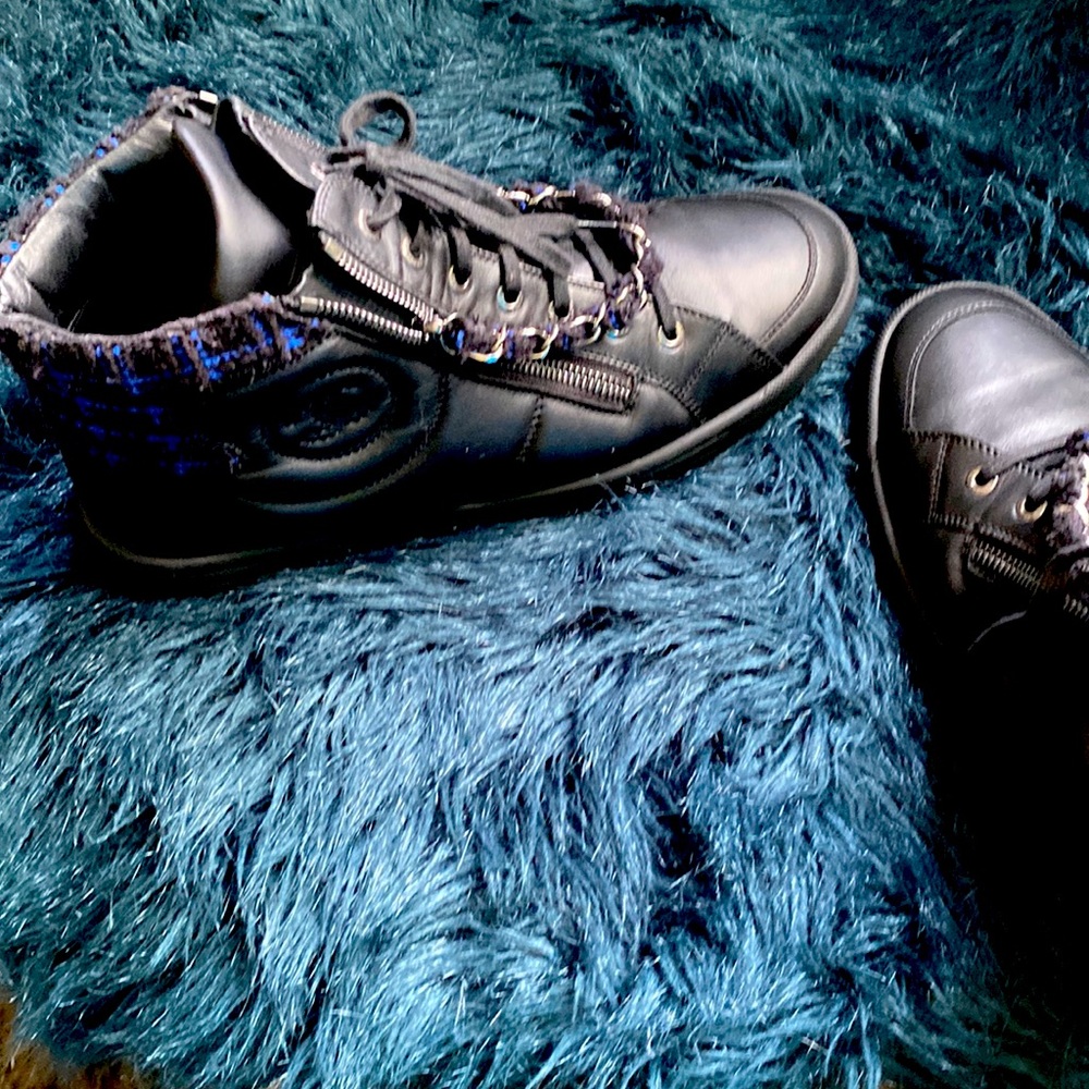 Chancel embroidered sneakers with zipper in front on both side.